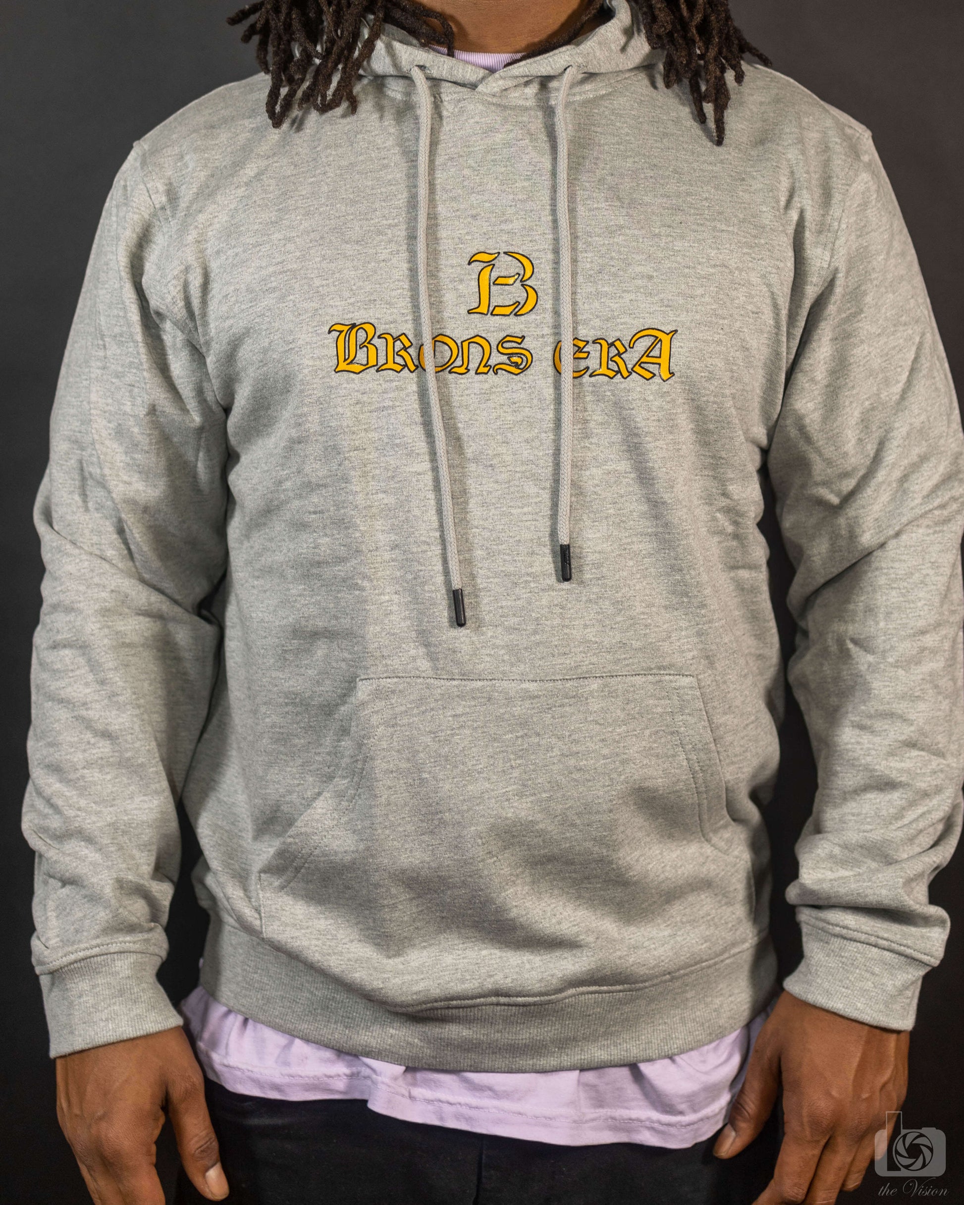 Brons era hoodie in gray, featuring a stylish logo, made from organic cotton with a relaxed fit for comfort.