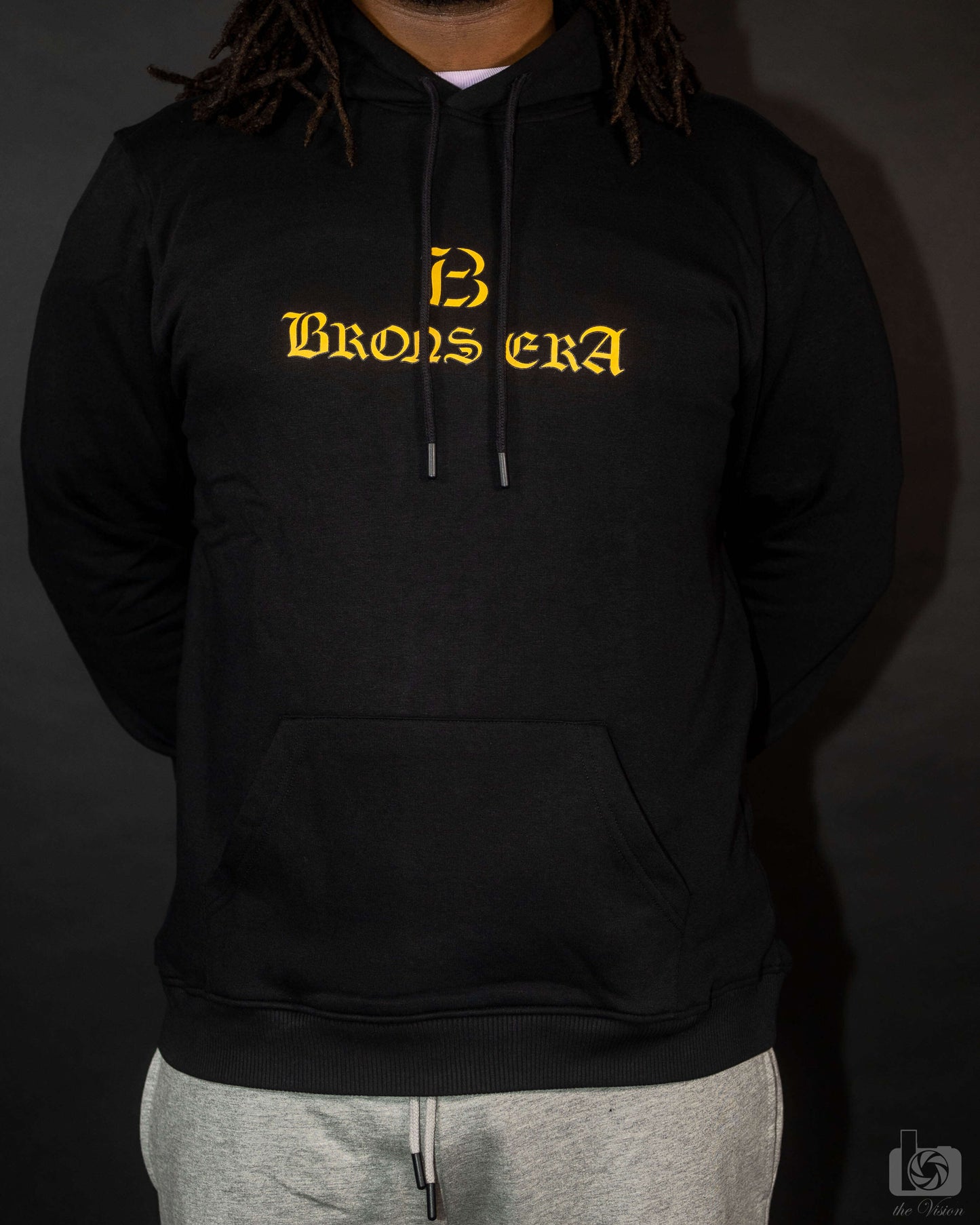 Brons era hoodie in black with stylish logo design, made from organic cotton for a relaxed fit and comfort.